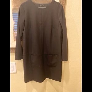 Theory black shift dress with front slash pockets.